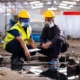 Professionals inspecting damage in industrial property