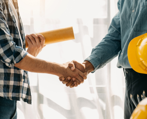 Construction team shake hands greeting start new project plan